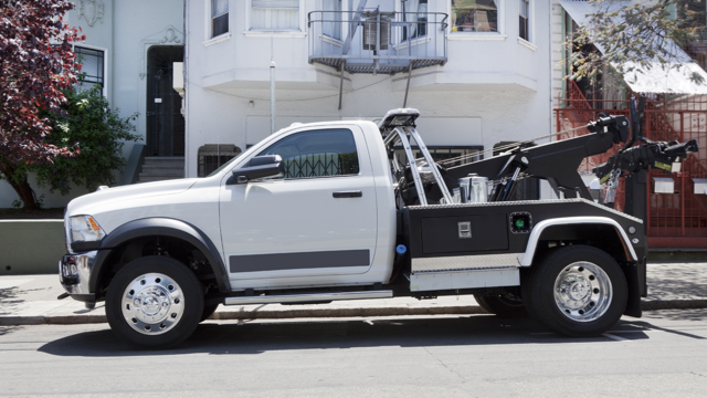 image of a parked tow truck in a residential neighborhood